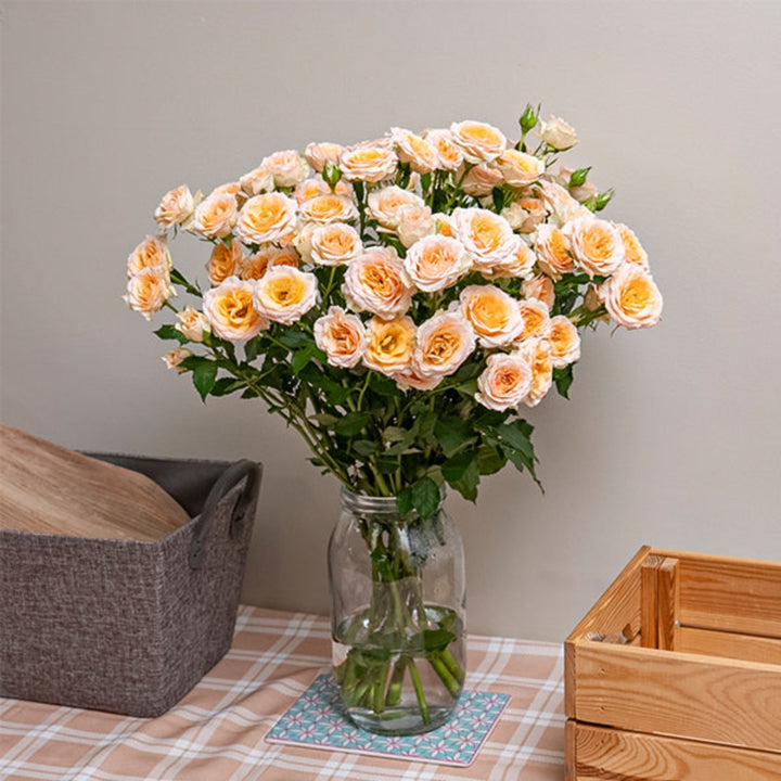 Bouquet of 10 Roses Baby Rosanella flowers by SQ Flora Kenya, showcasing vibrant pink blossoms on green stems.