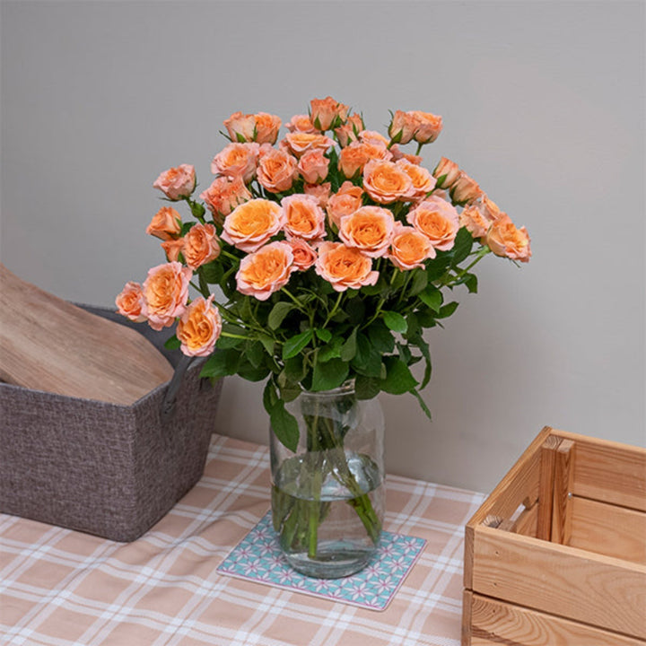 Bouquet of 10 stems of Roses Baby Sundial flowers from SQ Flora Kenya, arranged in a natural display.