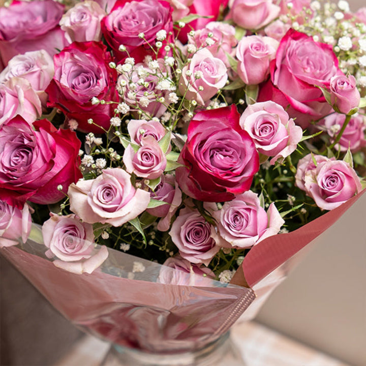 Beautiful roses bouquet featuring 23 purple roses from Mix Flower Bouquet, showcasing vibrant, fresh floral arrangement.