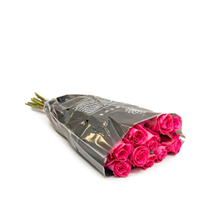 Fresh red roses from Annakrya by Vegpro Kenya, 10 stems arranged in a bouquet with lush green leaves.