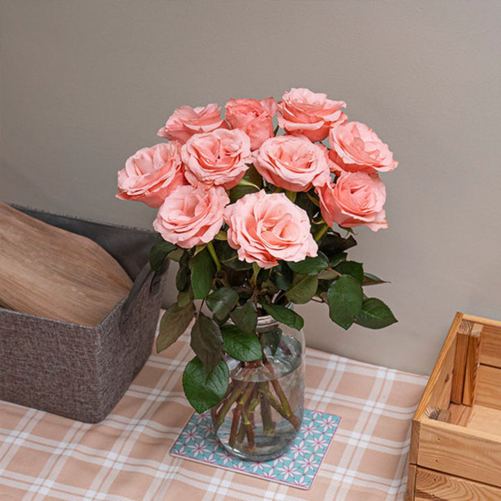 Pink Be Sweet Roses from Black Tulip with 10 stems, fresh flower bouquet with vibrant pink blooms and green foliage.