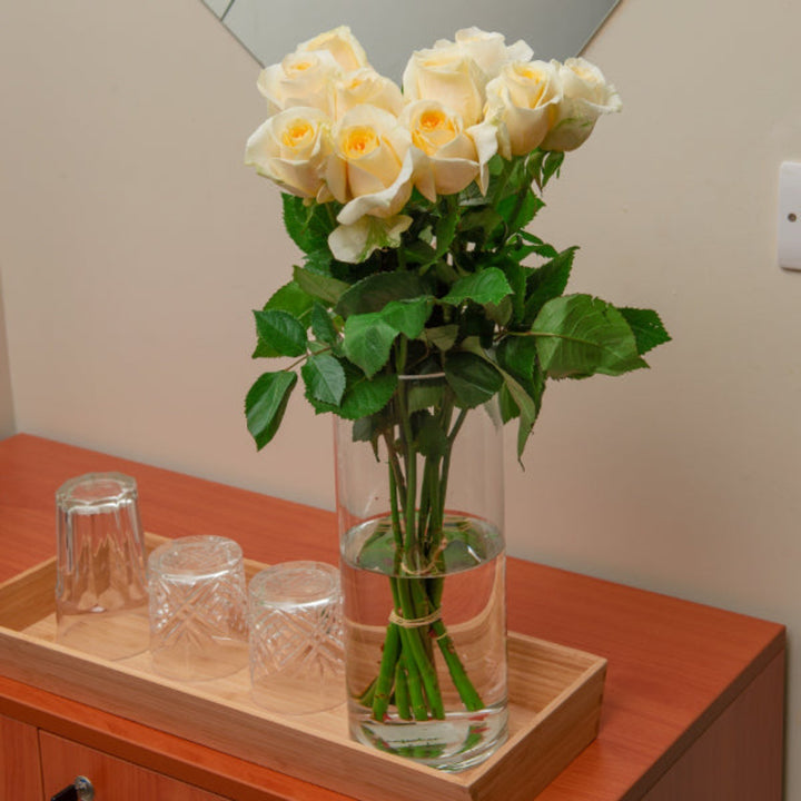 Bouquet of 10 Creme de la Creme roses from Vegpro Kenya, fresh flower arrangement with vibrant blooms and lush green leaves.