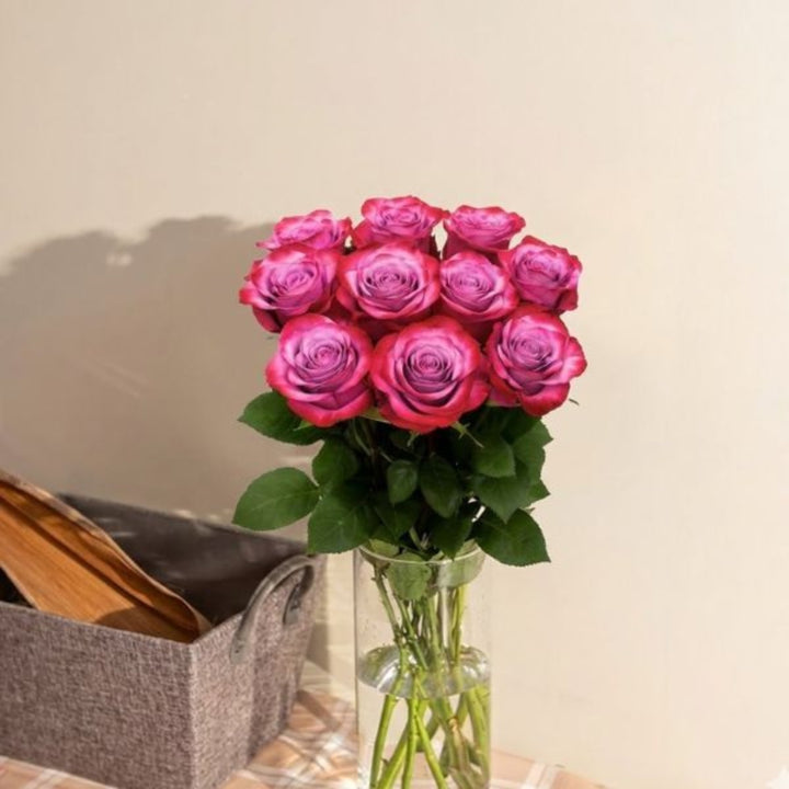 Deep purple roses from SQ Flora Kenya, 10-stem flower bouquet with vibrant, fresh blooms arranged naturally.