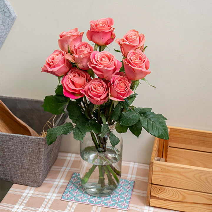 Bouquet of 10 Hermosa roses by Bella Rose, fresh pink flower stems arranged beautifully for a floral display.