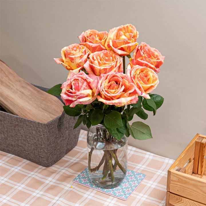 Jumbo Fiesta Feelings roses by Vegpro Kenya, 8-stem bouquet of vibrant, fresh red roses with lush green foliage.