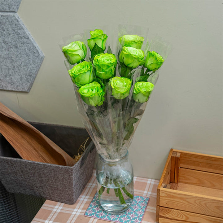 Green-tinted roses by SQ Flora Kenya, 10 individually wrapped single stems for National Day celebration, fresh floral display.