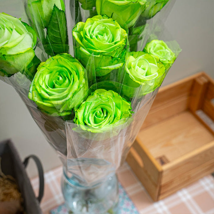 Green-tinted roses from SQ Flora Kenya, 10 individually wrapped single flower stems for National Day celebration.