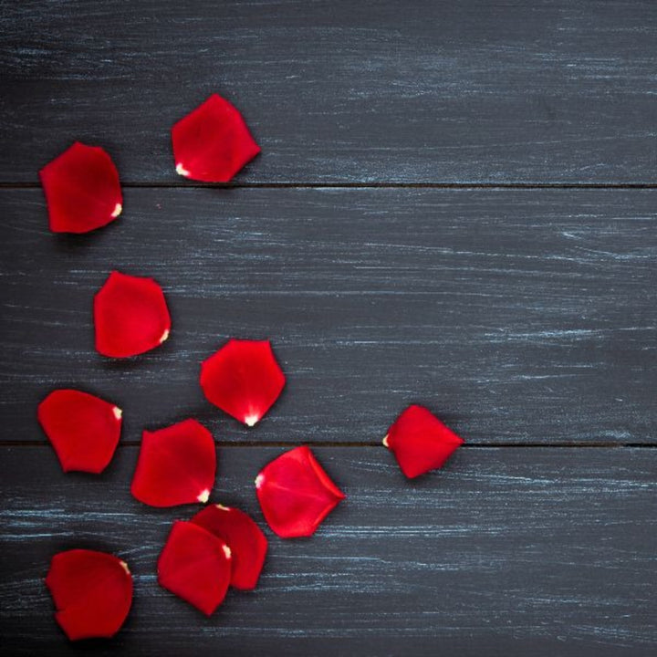 Red rose petals in a 0.1 kg pack from Fresh Flowers Kenya, showcasing vibrant, fresh flower petals for decoration or crafts.