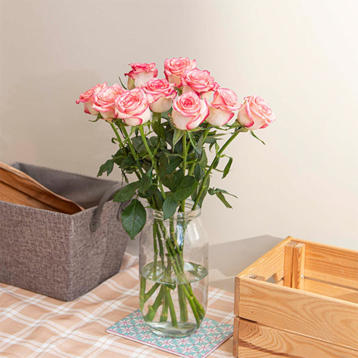 Bouquet of 10 fresh Salimia roses from SQ Flora Kenya with vibrant red petals and green foliage.