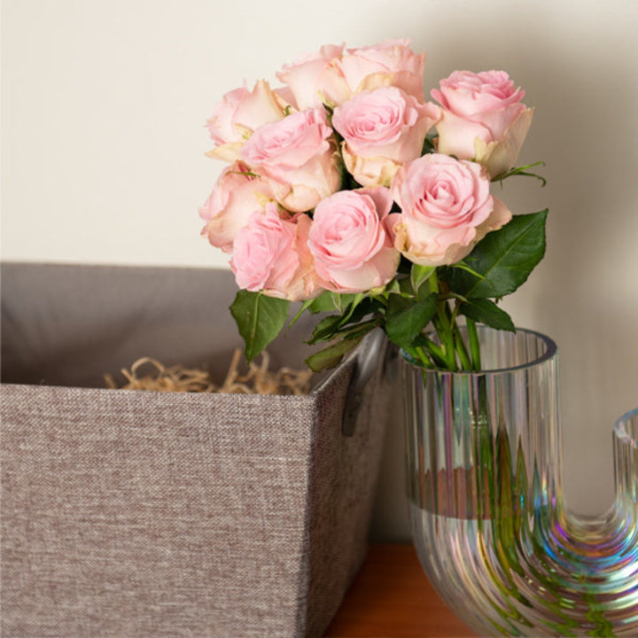 Bouquet of 10 Sweet Revival roses from SQ Flora Kenya, showcasing vibrant red and pink blooms arranged in a floral display.
