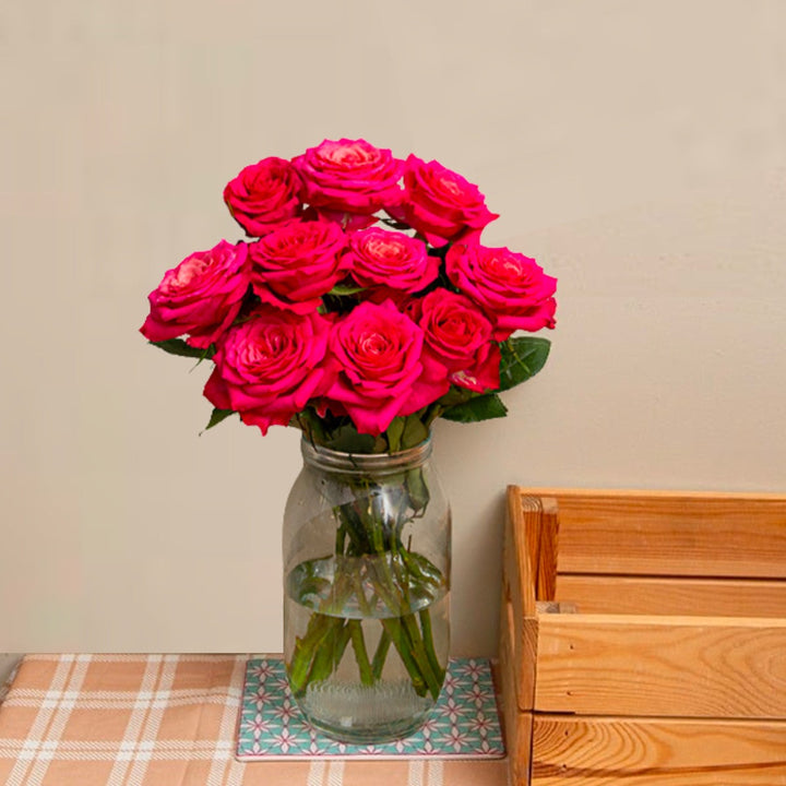 Bouquet of 10 Tatjana roses from SQ Flora Kenya, fresh flower stems with vibrant pink blooms and green foliage.