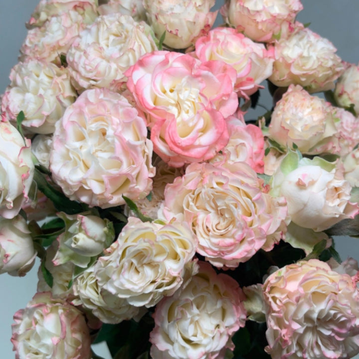 Bouquet of 10 spray roses from Vegpro Kenya in a garden-inspired charming flow arrangement, perfect for home decor.