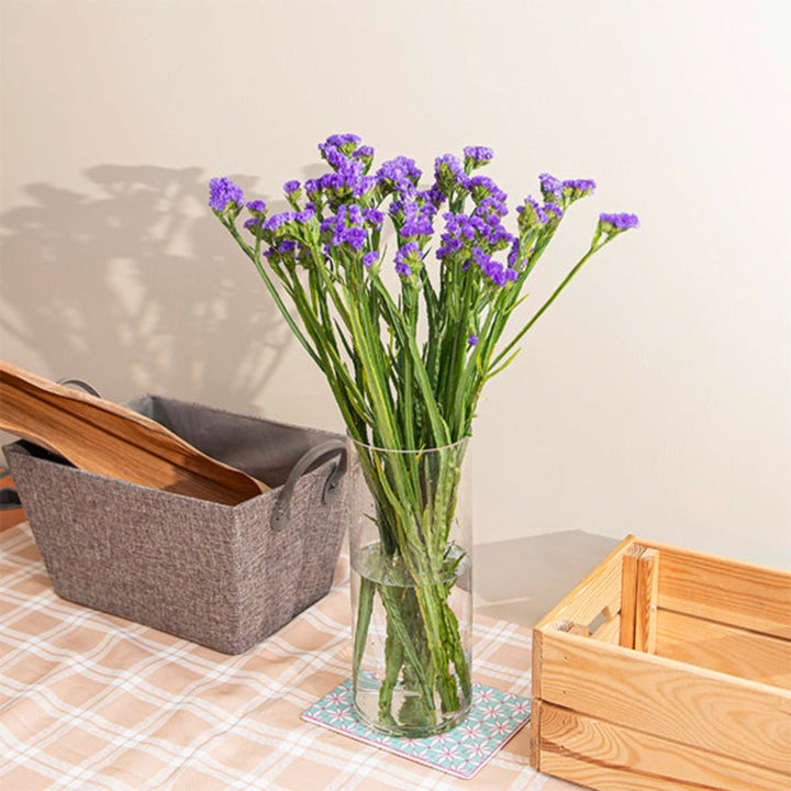 Blue Statice flowers in a bouquet, 10 stems, from SQ Flora Kenya, showcasing vibrant, delicate purple blooms.