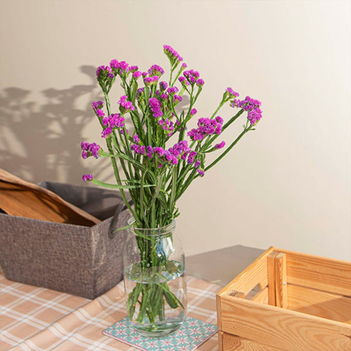 Pink statice flowers from SQ Flora Kenya, showing 10 stems with vibrant, delicate blossoms in a natural bouquet arrangement.