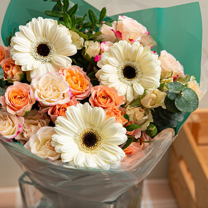 Bright Sunshine Joy bouquet with 13 colorful mixed flowers, showcasing vibrant blooms in a natural floral arrangement.