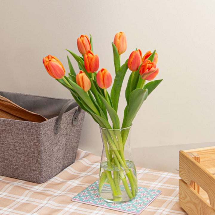 Bright orange tulips from Fresh Flower Holland, 10 stem bouquet showcasing vibrant blooms and green foliage.