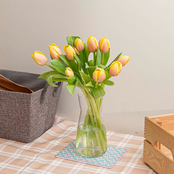 Fresh Peach Tulips flower arrangement with 10 stems from Fresh Flower Holland, showcasing vibrant blooms and green foliage.