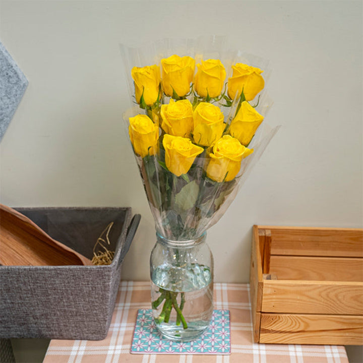 Bright yellow rose flower stem by SQ Flora Kenya, single wrapped, showcasing fresh, vibrant blooms perfect for floral arrangements.