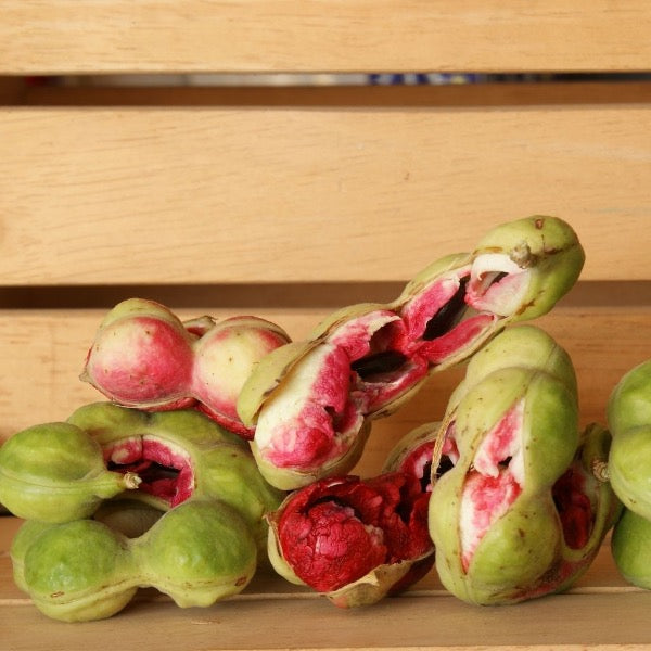 Close-up of Tamarind Manila and Indian red almonds in a 0.35 kg pack from Local Market, showcasing the fruit and nuts.