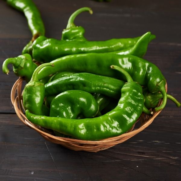 Green Anaheim peppers in a 0.5 kg pack from Local Market, fresh long vegetables ready for cooking or snacking.