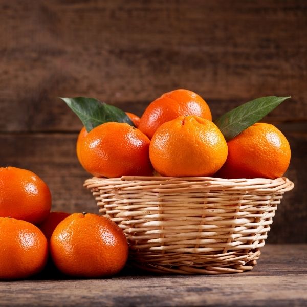 Fresh Kinnow mandarins in a 2 kg bag from Sharbatly, showcasing bright orange citrus fruit with smooth skin.