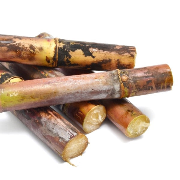 Peeled sugarcane vegetable from Local Market, 0.25 kg net, fresh and fibrous with green stalks and peeled sections visible.