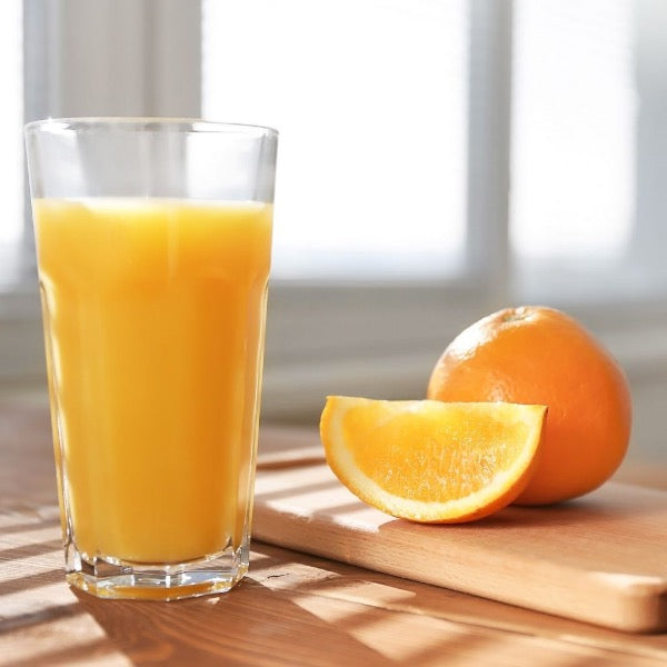 Fresh Valencia oranges from Sharbatly for juice, 2 kg bag, showing bright orange citrus fruits with textured skin.