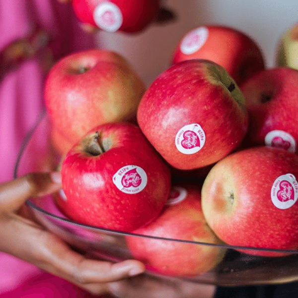 Pink Lady apples from Sharbatly, 1 kg pack, fresh and vibrant fruit with bright red and yellow skin.