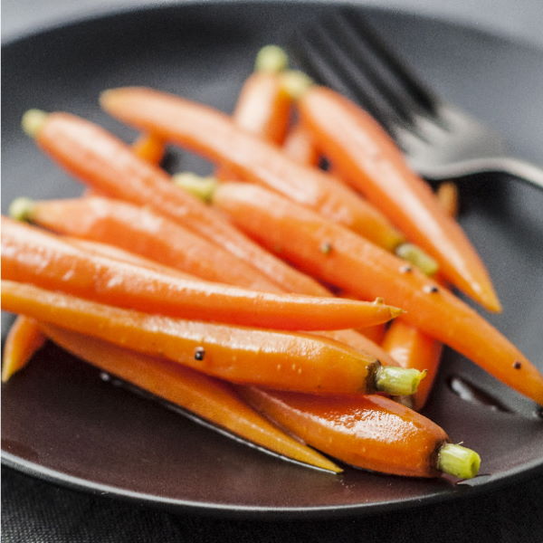 Whole baby carrots from Holland in a 0.2 kg pack, fresh and vibrant orange vegetables for healthy snacking or cooking.