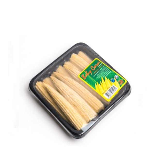 Fresh baby corn from Thailand in a 0.1 kg pack, showcasing small yellow corn cobs with green husks and tender kernels.