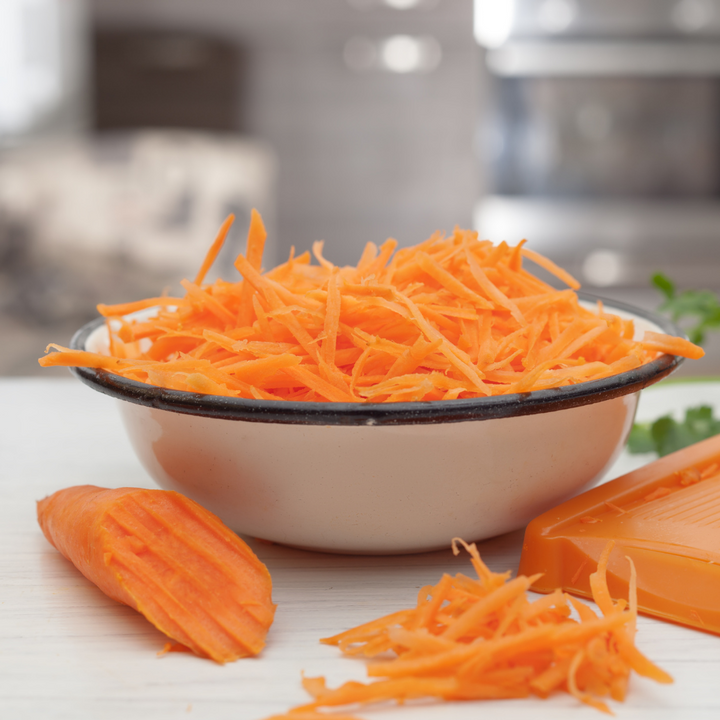 Fresh medium carrots from Sharbatly in a 1 kg bag, showcasing bright orange vegetables perfect for cooking and snacking.