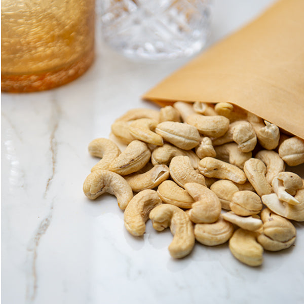Raw cashews from Fresh Nuts in a 0.25 kg pack, showcasing natural, unroasted nuts on a white background.