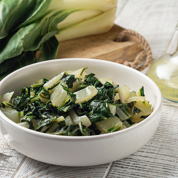Fresh green Swiss chard bunch from Holland, showcasing vibrant leaves and sturdy stems in a natural vegetable display.