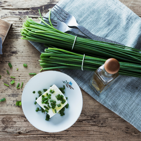 Fresh Kenya herb chives in a 0.1 kg pack, vibrant green and finely chopped, ideal for garnishing and cooking.