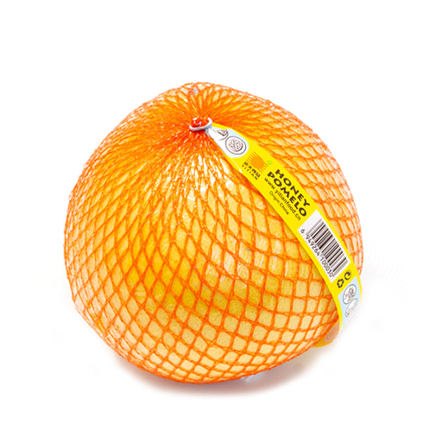 Fresh Sharbatly pomelo fruit on a white background, showcasing its round shape and bright yellow exterior.