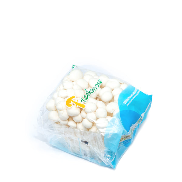 Fresh white Shimeji mushrooms in a Holland vegetable pack, showcasing clustered mushrooms with stems and caps.