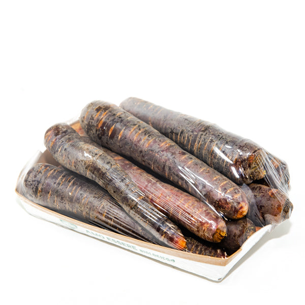 Purple carrots from Holland, 1 kg pack, fresh violet vegetable with vibrant color and leafy green tops.