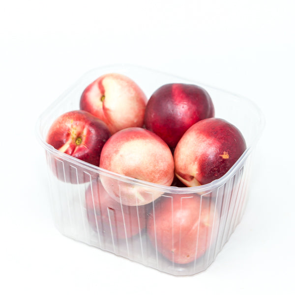 White nectarine fruit in a 1 kg pack from Local Market, fresh and ripe, ready for healthy snacking or dessert.