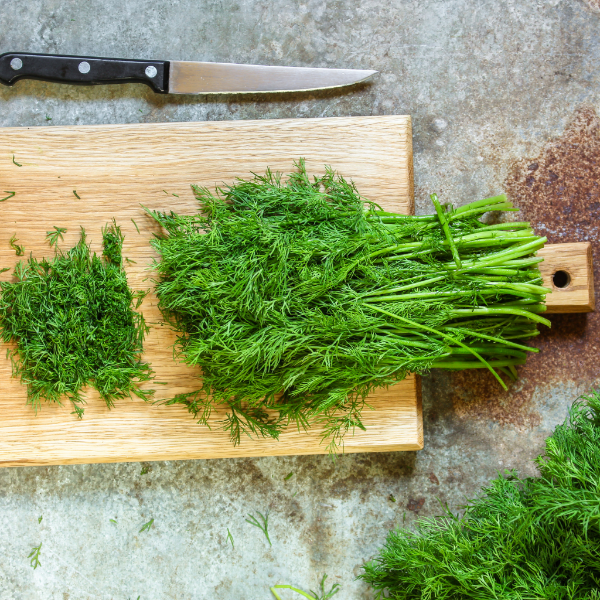 Fresh dill herb bunch from Local Market, 0.1 kg, showing vibrant green leafy dill with stems ready for cooking or garnishing.