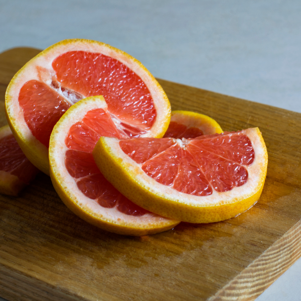 Fresh pink grapefruits from Sharbatly in a 2 kg bag, showcasing bright, ripe fruit with smooth, vibrant skin.
