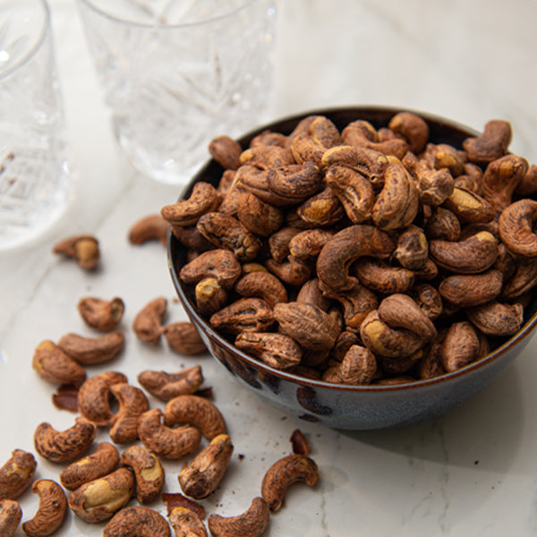 Grilled fresh cashews with peel in 0.45 kg pack, showing golden-brown roasted nuts from Fresh Nuts.