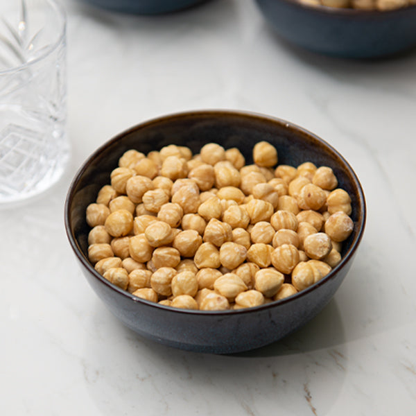 Fresh Nuts all-natural hazelnuts in a 0.25 kg pack, showing whole, roasted hazelnuts in their shells.