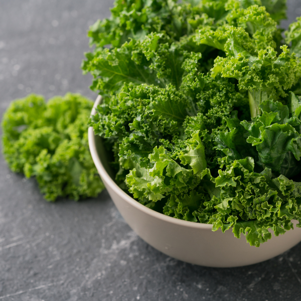 Fresh curly kale superfood vegetable in a 0.5 kg bag from Local Market, showcasing vibrant green leaves.
