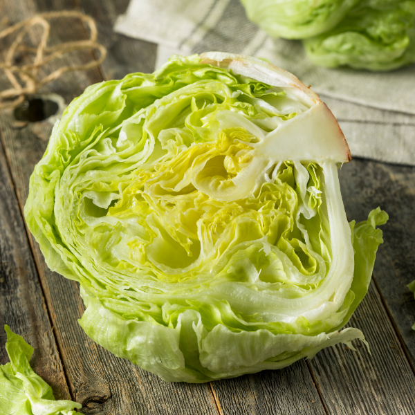 Fresh iceberg lettuce leaf from Sharbatly, showcasing crisp, green vegetable with textured surface on a white background.