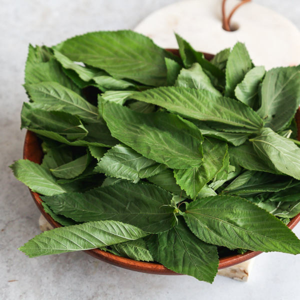 Fresh Molokhia leaves in a 0.25 kg pack, a popular vegetable from Local Market, ready for cooking or meal preparation.