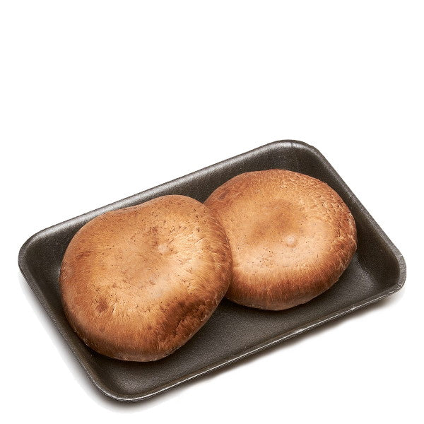 Fresh Portobello mushrooms from Holland in a 0.2 kg vegetable pack, showing large, brown, cap-shaped mushrooms with gills visible.