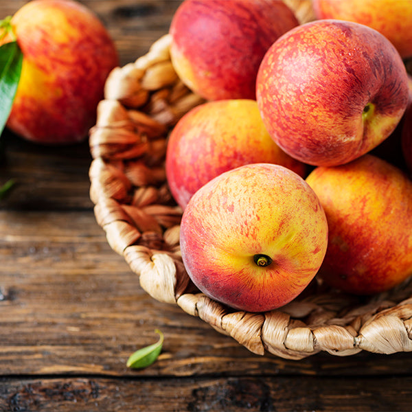 Fresh nectarines in a 1 kg pack from Sharbatly, showcasing ripe, juicy fruit with vibrant orange skin and smooth texture.
