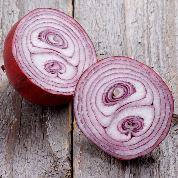 Red onions from Local Market in a 1.6 kg bag, fresh vegetables with vibrant red skins and layered onion bulbs.