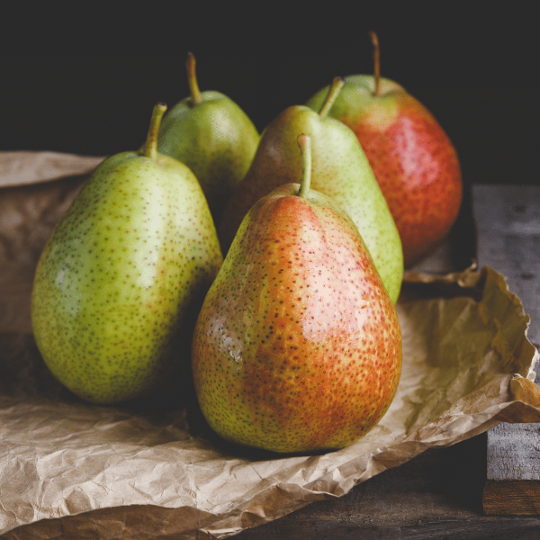 Fresh Forelle pears in a 1 kg pack by Sharbatly, showcasing ripe, colorful fruit with smooth skin and vibrant yellow-red hues.