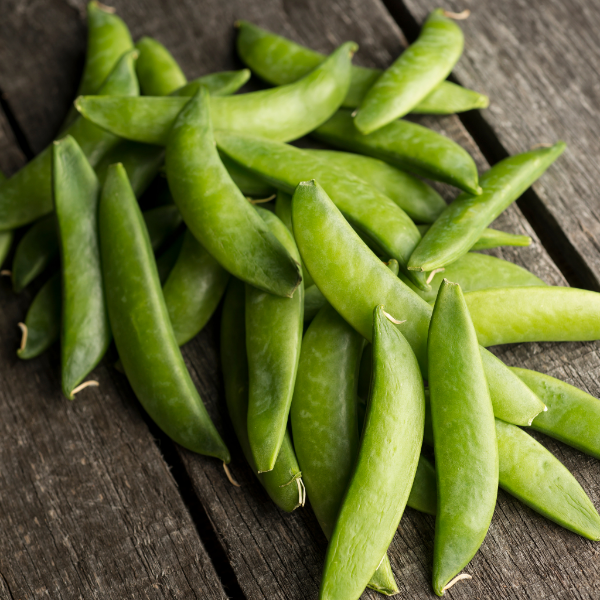 Fresh string-less sugar snap peas from Kenya in a 0.250 pack, showcasing vibrant green vegetable pods.